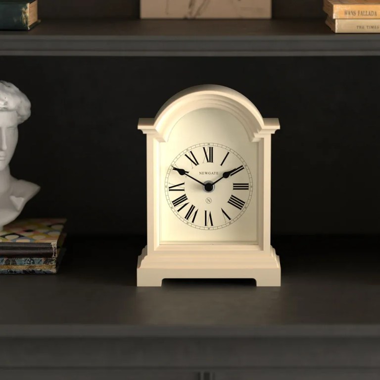 newgate fillmore mantel clock vanilla cream White mantel clock with Roman numerals on shelf