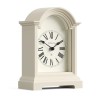 Cream arched mantel clock with Roman numerals