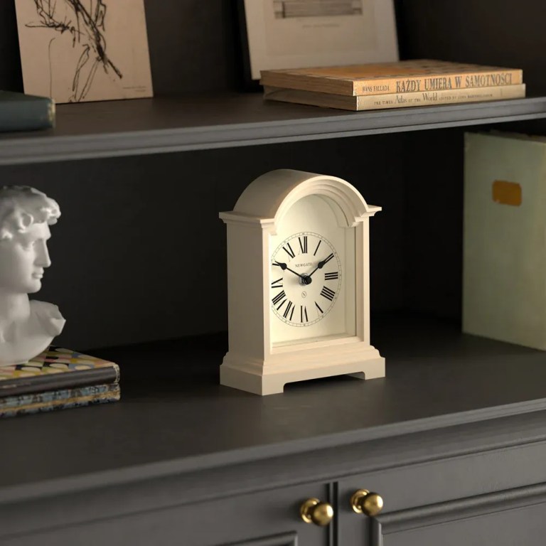 newgate fillmore mantel clock vanilla cream White mantel clock on dark wooden shelf