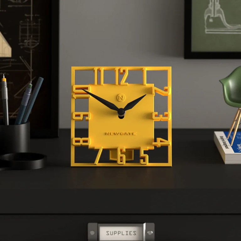 Yellow square desk clock with cut-out numerals
