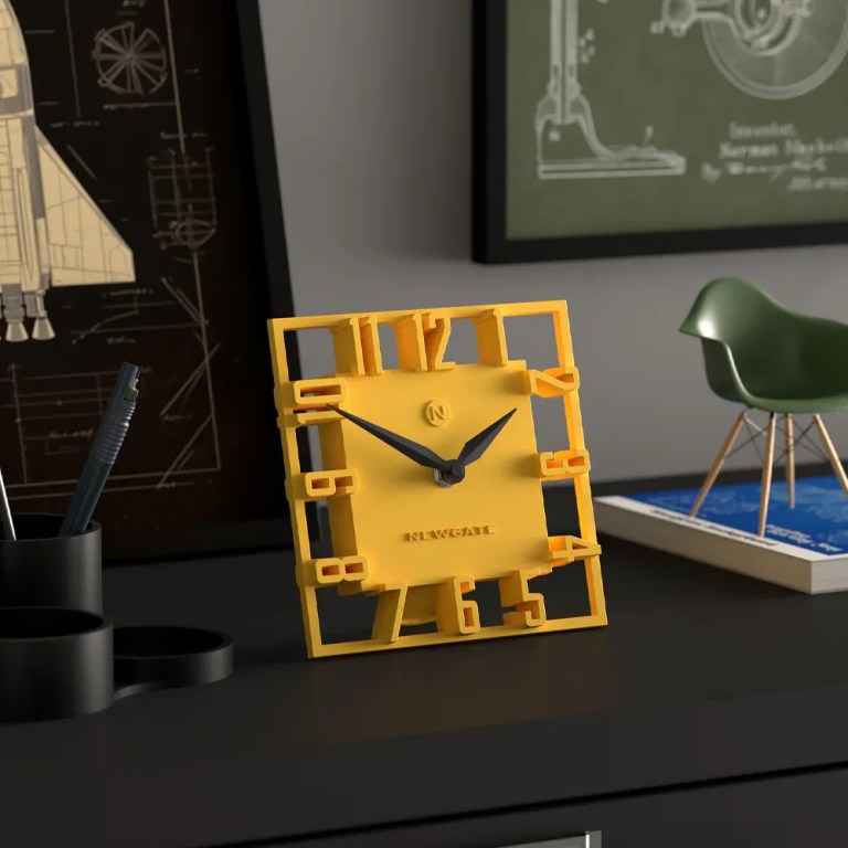 Modern yellow square clock on black desk