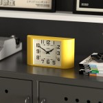 newgate mini metro mantel clock yellow Yellow retro alarm clock on modern cabinet