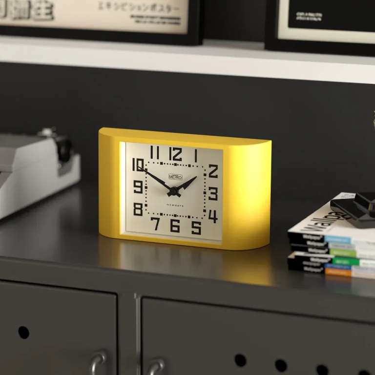 newgate mini metro mantel clock yellow Yellow retro alarm clock on modern cabinet