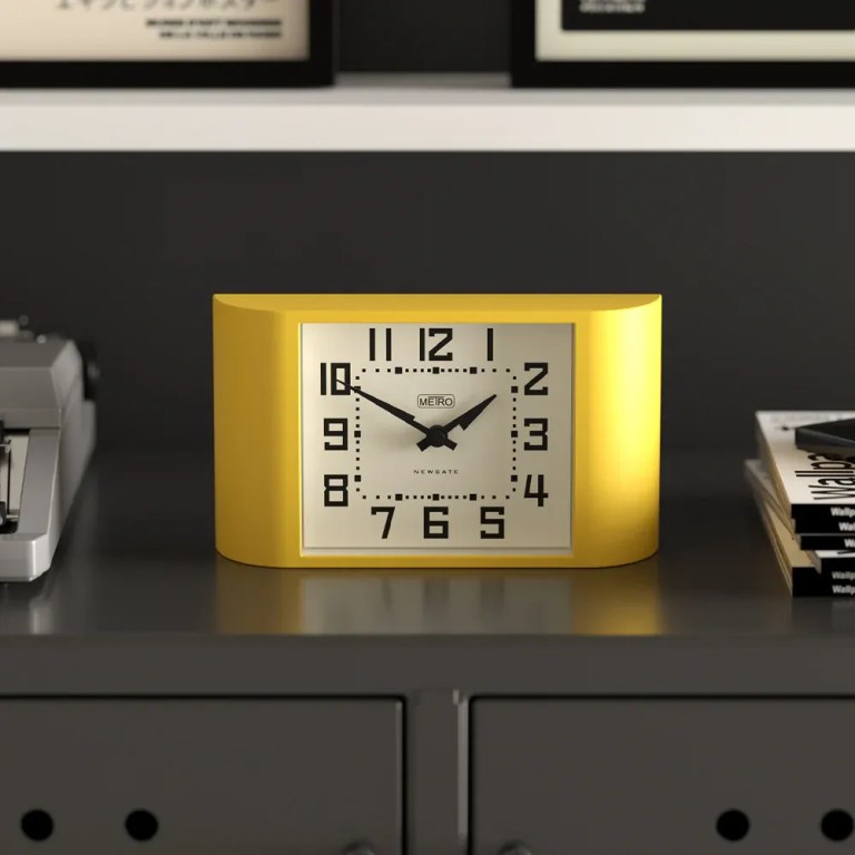 newgate mini metro mantel clock yellow Yellow retro alarm clock on dark cabinet