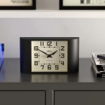 Black mantel clock on modern cabinet