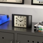 Black rectangular desk clock on modern cabinet