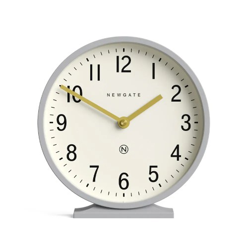 Round cream clock with gold hands at 10:10