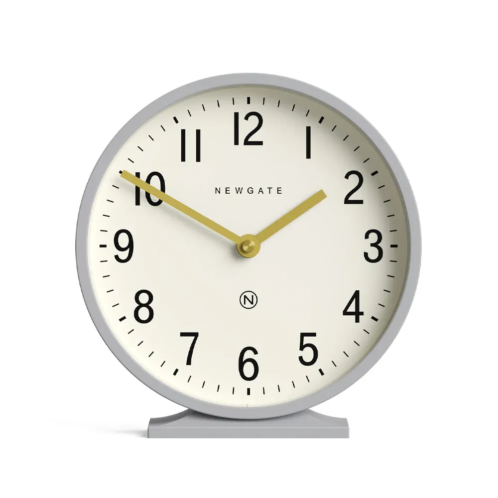 Round cream clock with gold hands at 10:10