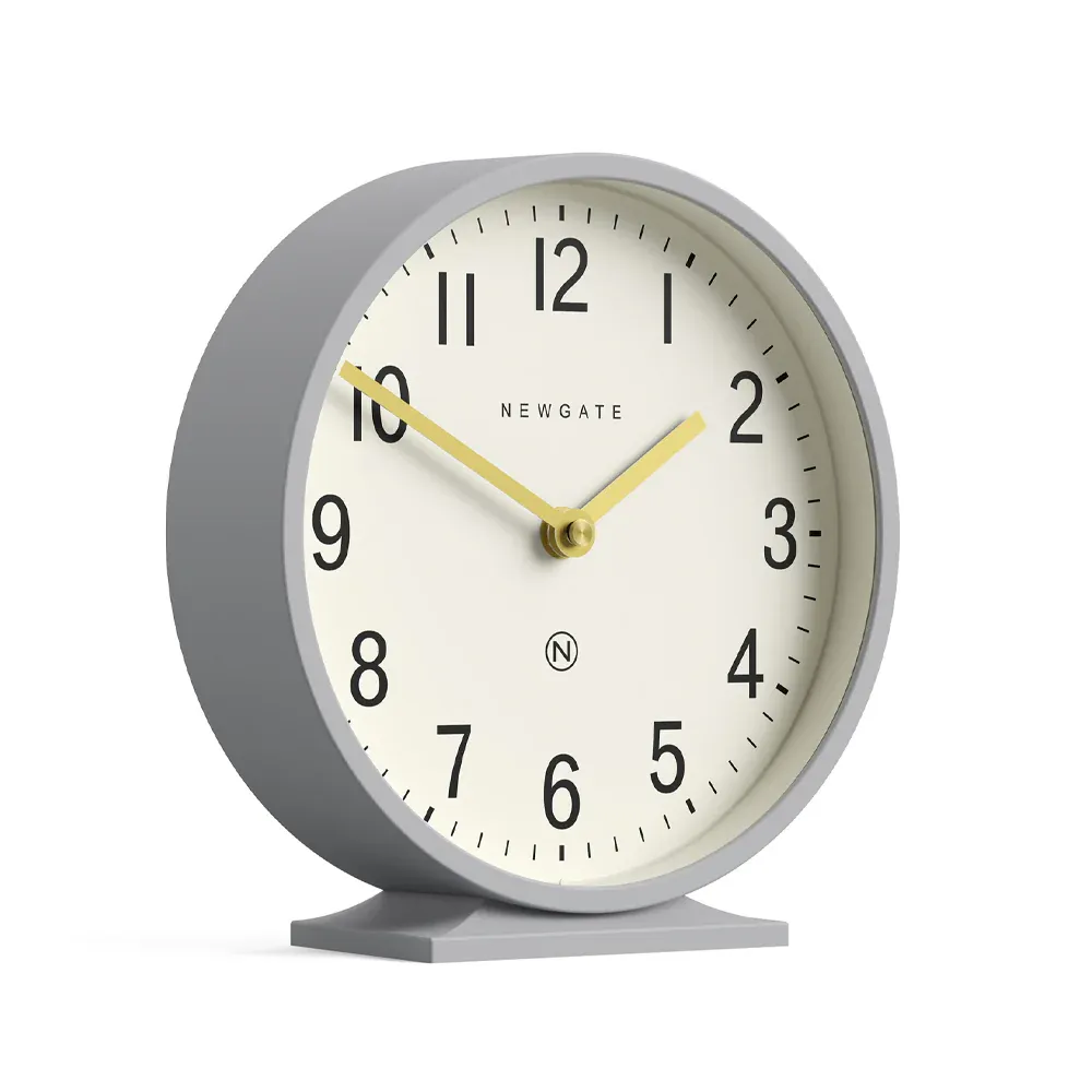 Grey mantel clock showing ten past ten