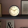 newgate q mantel petrol blue Round Newgate clock on shelf at 10:10