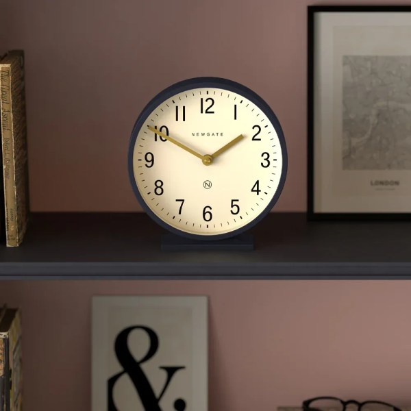 newgate q mantel petrol blue Round Newgate clock on shelf at 10:10