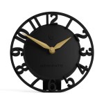Black modern wall clock with gold hands