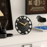 Modern black desk clock with gold hands