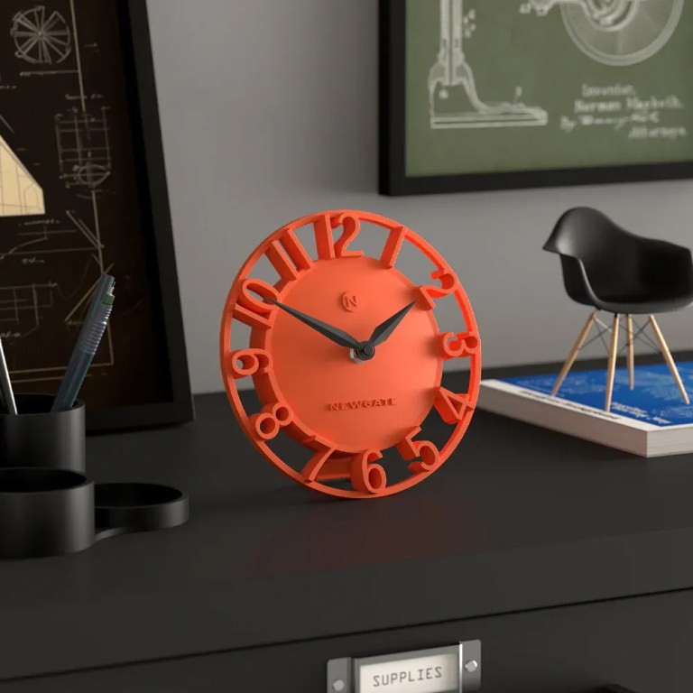 newgate timewarp mantel clock orange Modern orange desk clock on black table
