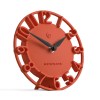 Red modern wall clock with cut-out numerals
