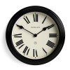 Black wall clock with Roman numerals