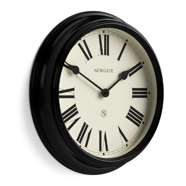 Black wall clock with Roman numerals