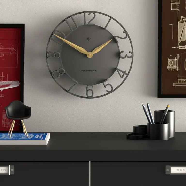 newgate time traveller wall clock grey Modern grey wall clock above sleek desk