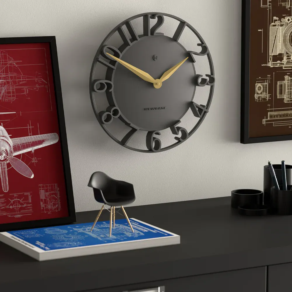 Modern wall clock above stylish desk setup