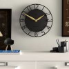 newgate time traveller wall clock black Modern black wall clock above minimalist desk