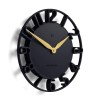 Modern black wall clock with gold hands