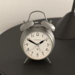 newgate new covent garden alarm overcoat grey Grey twin-bell alarm clock on bedside table