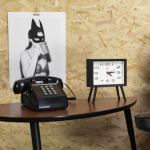 newgate henry mantel clock neutral mono ii dial Retro phone and clock beside monochrome poster