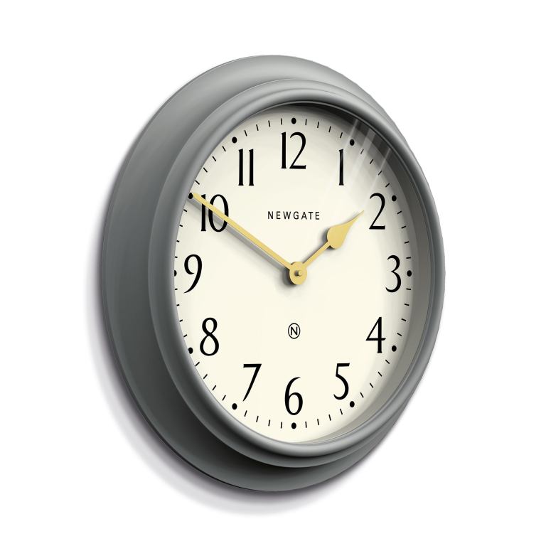 Close-up of grey wall clock with gold hands