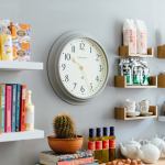 Modern kitchen wall with clock and wooden shelves