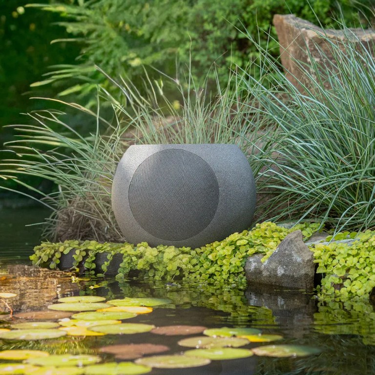 victrola zen premium solar garden speaker Outdoor garden speaker beside pond with lily pads