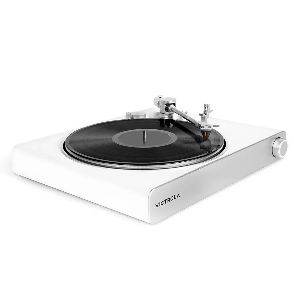 White Victrola turntable playing vinyl record