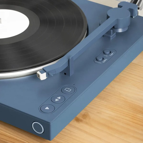 victrola automatic turntable blue Modern blue turntable playing vinyl record