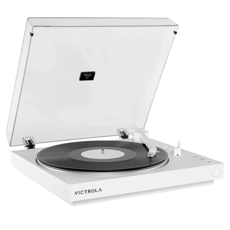 White Victrola turntable with vinyl record and lid open