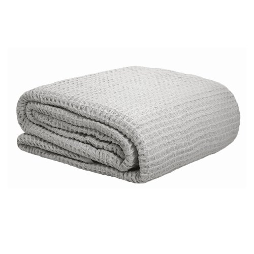 Folded light grey waffle-textured blanket