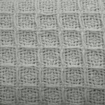 cotton waffle blanket silver single Close-up of white woven fabric texture