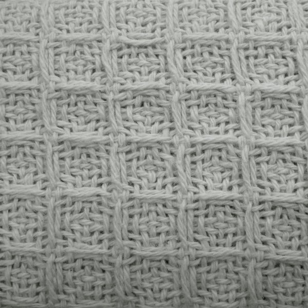 cotton waffle blanket silver single Close-up of white woven fabric texture