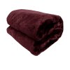 Folded burgundy faux fur blanket on white background