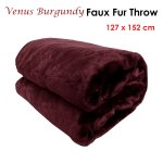 Folded burgundy faux fur throw blanket