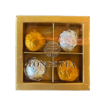 Boxed assortment of foil-wrapped tea balls