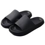 Black rubber slide sandals on white background