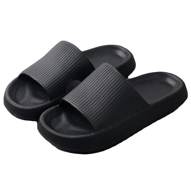 Black rubber slide sandals on white background