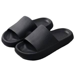 Black rubber slide sandals on white background