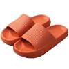 Orange textured slide sandals on white background