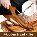 Wooden bread knife slicing crusty loaf