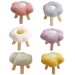 Six pastel flower-shaped stools with wooden legs