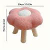Pink flower-shaped stool with wooden legs