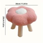 Pink flower-shaped stool with wooden legs