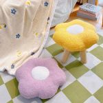 Flower-shaped stools and cushion in cosy room