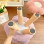 Upside-down pink stool with wooden legs