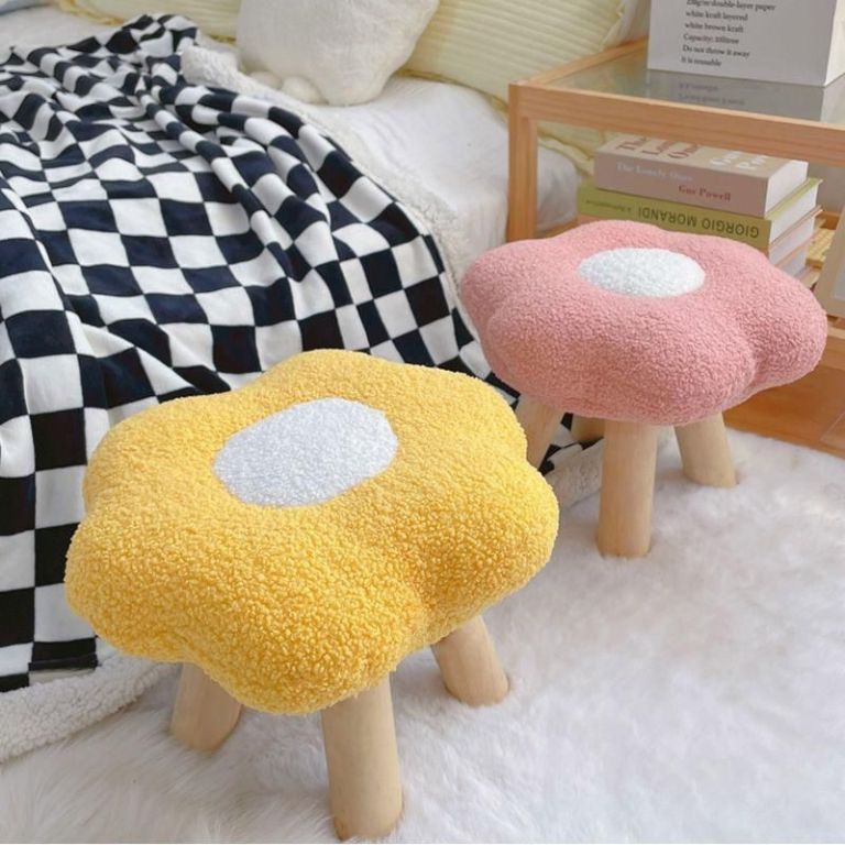 Flower-shaped stools in cosy bedroom setting